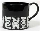 Lot# 267 WEDGWOOD BLACK BASALT SPORTS MUG, H 4", black basalt Wedgwood 'Special Edition Sports Mug' designed by Richard Guyatt. Having white jasper depicting Olympic sport venue symbols on the sides.