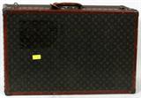 Lot# 317 LOUIS VUITTON, ANTIQUE, FULL SIZE SUITCASE, C1950, H 21", W 32", D 9", having the signature Monogram coated canvas sides, leather trim at the edges and brass corner caps; leather handle (as is); hinged lid with brass lock and latches.