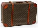 Lot# 319 LOUIS VUITTON SUITCASE, 17 1/2" X 27 1/2", Purchased at B. Altman. Were used on the Queen Mary II. Some slight staining to the leather and interior. Monogrammed BSRK.