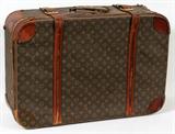 Lot# 322 LOUIS VUITTON SUITCASE, H 17", W 27", Purchased at B. Altman. Used on the Queen Mary II. Monogrammed BRK. Some staining and wear.
