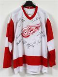 Lot# 377 LINDSAY, HOWE AND ABEL, ETC., AUTOGRAPHED DETROIT RED WINGS, WHITE AWAY JERSEY, NHL replica white away jersey signed by Ted Lindsay, Gordie Howe, Sid Abel, Alex Delvecchio, Steve Yzerman, Sergi Federov (signed in Russian) and Bob Probert; Chicago Black Hawk left winger, Bobby Hull, Boston center Phil Esposito. Unframed;