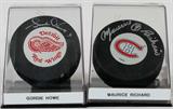 Lot# 387 GORDIE HOWE AND MAURICE RICHARD AUTOGRAPHED HOCKEY PUCKS 2 PCS., includes one Detroit Red Wing hockey puck autographed by Gordie Howe and one Montreal Canadians puck signed by Maurice Richard. In plastic containers.