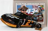 Lot# 389 NASCAR MEMORIALBIA, RICHARD PETTY AUTOGRAPHED POSTER, RUSTY WALLACE SIGN AND MINI - HELMET, 3 PCS., includes one autographed Richard Petty color poster entitled: "The King Will Always Rule", Pub. by Pontiac Motor Sports, 24" x 32", framed and matted under glass; also includes an autographed Rusty Wallace three dimensional publicity sign depicting Rusty Wallace's race car with Wallace signature on bottom of car door; also includes a miniature Rusty Wallace autographed Simpson helmet, signed on the visor, 5" H., mounted on wood base,