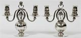 Lot# 1004 GEORG JENSEN 'POMEGRANATE' STERLING TWO-LIGHT CANDELABRA, C. 1925-32, PAIR, H 8 3/4", W 9 1/2", Designed by Georg Jensen, each has two scroll arms, berry central standard, raised on a ball stem and circular base, stamped number 324 (see additional photo). Each weighs approximately 37.03 troy oz. From the Estate of Walter Connolly, Grosse Pointe Farms, Mi.