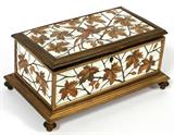 Lot# 1002 FERDINAND DUVINAGE IVORY & FRUITWOOD MARQUETRY JEWEL CASKET, PARIS, C. 1875, H 4", W 8", Rectangular box finely inlaid with a bird among leaves and branches, signed at the hinged cover "FD Bté" and "Alph. Giroux Paris" at the interior rim, opens to the original tufted silk lined interior, gilt metal frame, raised on four feet. No key. The Maison Alphonse Giroux, founded in 1799, was taken over by Duvinage and Harinkouck in 1867. Measures H.3 3/4" x 8 1/4" x 4 3/4". From the Estate of Walter Connolly, Grosse Pointe Farms, Mi.