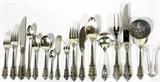 Lot# 1008 WALLACE 'GRAND BAROQUE' STERLING FLATWARE, 113 PIECES, Including 12 place knives, L.9", 12 place forks, L.7 1/2", 11 salad forks, 11 cream soup spoons, 12 flat butter spreaders, 25 teaspoons, 10 demi tasse spoons, and 8 iced tea spoons, as well as 1 gravy ladle, 1 cold meat fork, 3 serving spoons, 1 sugar spoon, 1 lemon fork, 1 master butter knife, 1 pierced tomato server, 1 sugar tongs, and a 2-piece carving set, L.10 3/4" (knife). Totaling approximately 136.15 troy oz. weighable. Not monogrammed. From the Collection of John P. O'Hara, Bloomfield Hills, Mich.