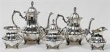 Lot# 1005 POOLE 'LANCASTER ROSE' STERLING TEA & COFFEE SET, FIVE PIECES, Including 1 teapot, H.10", 1 coffee pot, H.11", 1 creamer, 1 covered sugar bowl, H.7 1/2", and 1 waste bowl; each having a bulbous, ribbed body on footed base. #990. Totaling approximately 113.85 troy oz. From the Collection of John P. O'Hara, Bloomfield Hills, Mich.