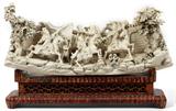 Lot# 1009 CHINESE CARVED IVORY FIGURAL SCENE IN FULL RELIEF, H 11", L 18", Depicting an attacking army with five figures on horseback, city wall backdrop with three seated figures at the top, flanked by two fully carved trees. From the Collection of John P. O'Hara, Bloomfield Hills, Mich.