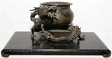 Lot# 1014 JAPANESE BRONZE VESSEL WITH DRAGON SUPPORT, ANTIQUE, H 6", W 8", Usubata style vessel with applied dragon about the exterior, signed (see photo). From the Collection of John P. O'Hara, Bloomfield Hills, Mich.