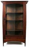 Lot# 1023 GUSTAV STICKLEY CRAFTSMAN WORKSHOPS OAK SINGLE-DOOR CABINET (NO. 803), H 60", W 36", Harvey Ellis designed china cabinet, having a single glass door opening to three adjustable wood shelves, early Eastwood paper label on the reverse (see additional photos). Measures H.60" x 36" x 15".