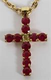 Lot# 1040 4.75CT RUBY DIAMOND CROSS WITH .32CT FANCY YELLOW IN CENTER, L 1 1/2", 14kt yellow gold. 16.6 grams.