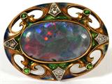 Lot# 1045 14KT GOLD, OPAL (20 X 11.5MM), DIAMOND & ENAMEL BROOCH, Australian opal brooch circa 1880, setting marked 14kt gold. Opal is 20 x 11.5mm. Setting has four emeralds and four enhancement diamonds.