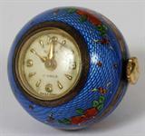 Lot# 1050 RITMA, SWISS ENAMELED SILVER PENDANT WATCH, 17 jewels, Swiss made. Delicate enamel work having a blue ground with delicate flowers and ribbons.