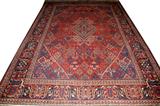 Lot# 1054 BIJAR PERSIAN WOOL RUG, C. 1920, 11' 7" X 8' 2", Red ground, central medallion and multi-colored geometric designs.