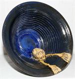 Lot# 1086 PETER THE POTTER (20TH C.) BLUE CERAMIC BOWL, H 11", DIA 16", An unglazed figure at the interior of the bowl, on a pedestal base, signed at the underside. Peter F. Johnson of Whitehall, Michigan. From the Collection of John P. O'Hara, Bloomfield Hills, Mich.