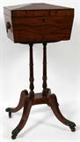 Lot# 1097 ENGLISH REGENCY MAHOGANY TEAPOY, EARLY 19TH C., H 32", W 15", D 10", Sarcophagus form flanked by lion mask-and-ring handles, the hinged lid opens to two hinged compartments and center well, raised on two turned supports atop a platform ending in four splayed legs with paw feet and casters.