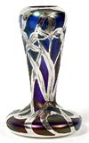 Lot# 1132 ALVIN STERLING OVERLAY ART GLASS BUD VASE, EARLY 20TH C., H 4", Bohemian iridescent blue glass bud vase with Alvin sterling silver overlay, stamped at the rim of the underside with the Alvin trademark, "999/1000 Fine, 3375, Patented" (see additional photo).