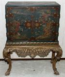 Lot# 1152 LACQUER DECORATED CABINET, C. 1900, H 50", W 40", D 21", Two hinged doors with prominent brass hardware, hand-decorated motif of exotic birds on rocky formations, raised on bold cabriole legs that are gilded. From the Collection of John P. O'Hara, Bloomfield Hills, Mich.
