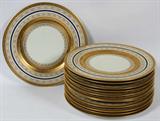Lot# 1202 HEINRICH & CO. PORCELAIN SERVICE PLATES, SET OF TWELVE, DIA 11", Each is hand-decorated with gold banding on an ivory ground, punctuated by a band of cobalt blue, stamped in green on the reverse (see photo).