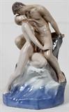 Lot# 1222 ROYAL COPENHAGEN PORCELAIN FIGURAL GROUP, 'WAVE AND ROCK', #1132, H 18", Sculpture depicts lovers entwined. W 12", H 18.5". #1132, decorator "EE". Impressed "KK".