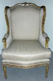 Lot# 1242 LOUIS XVI STYLE GILT CARVED WOOD ARMCHAIR, C. 1910, Hand-carved walnut frame, gilt finish. Tapered fluted legs. Loose seat cushion.