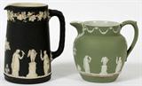 Lot# 1270 WEDGWOOD JASPERWARE PITCHERS, 19TH C., TWO, H 5" & 4", Black basalt and green jasper. Impressed Wedgwood and England. Allegorical cameo decoration.