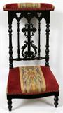 Lot# 1316 TURNED & CARVED EBONY PRIE DIEU, H 31 1/2", L 19", D 16", Upholstered kneeler and matching upholstered raised shelf.