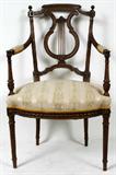 Lot# 1314 LOUIS XVI STYLE WALNUT ARMCHAIR (FAUTEUIL), C. 1920, Harp-form flanked by open arms. Spiral legs, nice carved detail include beading and finials. Upholstered spring style seat and padded arms.