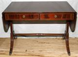 Lot# 1429 IRWIN FURNITURE CO. MAHOGANY SOFA TABLE WITH SATINWOOD BANDING, C. 1940, H 27", W 37", D 25". Two drawers in frieze, two drop leaves. Satinwood inlay. Irwin Furniture Co. Grand Rapids, Mi. Circa 1940.