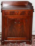 Lot# 1434 EMPIRE MAHOGANY CABINET/WASH STAND, H 34", W 24", A three-quarter gallery above a single drawer and cabinet door.