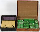 Lot# 1489 CELLULOID DOMINO SETS, C. 1880, TWO, One green celluloid studded with paste. Both are in vintage leather cases that are very worn and as is.