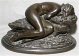 Lot# 2150 BRONZE SCULPTURE, H 8 1/2", L 15", SLEEPING NUDE FEMALE WITH HEAD BURIED IN A ROCK, Bronze base is all one with the sculpture, dimensions are total size; unsigned; modern.