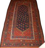 Lot# 2200 PERSIAN RUG C. 1900, 4' 5" X 7' 0", Navy field, rust, mid-blue. All wool, hand woven. From the estate of Gerry Culpepper, Northville, Mi.