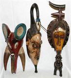 Lot# 2287 AFRICAN CARVED WOOD MASKS LOT OF THREE, H 25" - 18", Heights range from 18" to 25". Polychrome decoration. From the estate of Gerry Culpepper, Northville, Mi.