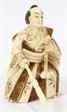Lot# 2390 CHINESE IVORY WARRIOR, H 2.5", Holding sword. Figure is carved in one piece, sword is separate. 2 1/2".