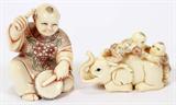 Lot# 2395 CHINESE HAND CARVED IVORY NETSUKE AND FIGURE, Netsuke depicts playful scene of children on elephant, L 2". Ivory carved figure of child beating drum, signed.