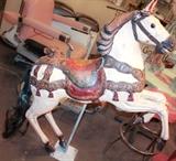 Lot #191, Large Vintage Carnival Or Fair Carousel Horse
An actual riding sized carousel horse complete with stand! This horse is white, with colored bridal and saddle. Various other parts of the horse, including the tongue, horseshoes, etc. have other distinctive colors as well. It's eyes are glass, and has a polymer tail. The lifelike glass eye almost looks like it is alive and staring at you. The horse is in generally good condition, with exception to a few hairlines cracks or punctures in expected areas. Measures: 65" x 28" x 70" Tagwords: collectors, children's room, decor, interior design, intdes, toys, carnival, state county fair