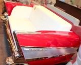 Lot #278, Furniture 1957 Chevy Bel Air Read End Diner Booth
This is the real deal! The rear end of a 1957 Chevrolet Bel Air has been repurposed / converted to a diner booth, sofa, or love seat. Additionally, it converts to a sleeper and comes with a twin (or slightly smaller) mattress. Custom built, it features a candy apple red body, chrome bumper and fittings, and working tail lights! It is fitted with white a white leather cushion and seat backs. Ideal for a man cave, recreation room or bar. Aside from a few light surface scratches it is in fantastic condition. The white leather has some light soiled areas but no rips or tears. Measures 34” tall x 71” wide x 49” depth. **This item cannot be shipped. See the front of the car in end lot # 26 Tag Words: Intdes, soda fountain, couch, tail fins, 50’s diner, furniture, retro