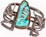 Lot #385, Jewelry Sterling Silver Turquoise Calla Lily Cuff
Stunning large vintage cuff bracelet with Southwestern / Western / Native American Indian style design. Featuring a large, speckled turquoise stone. Band is accented with two calla lily flower and twisted rope metal work designs. Unmarked, measures: 6" around with 1.25" opening x 2" wide. Total weight: 2.84 ozt.  Tag words: Anniversary, Gift, Valentine's Day, Valentine, Birthday, Fashion