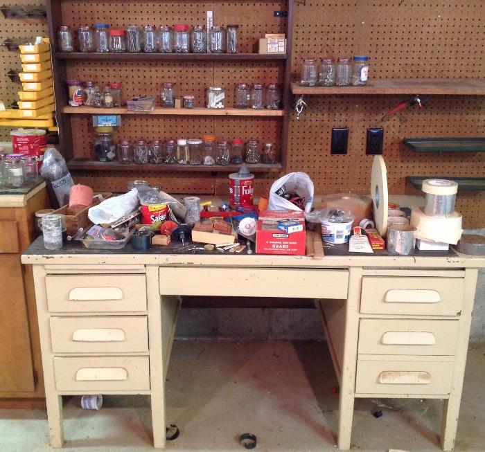 Old desk and jars of nuts, bolts, nails, etc