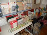 Lots of greeting cards, some loose, some boxed.
Also a lot of office & stationary items, old brochures, post cards,
photos, stamps on envelopes, including air mail and stamp collectors
stamps!