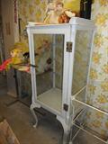 There are several medical cabinets and lots of medical instruments.