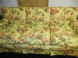 This is a bright and cheery 3 cushion sofa!