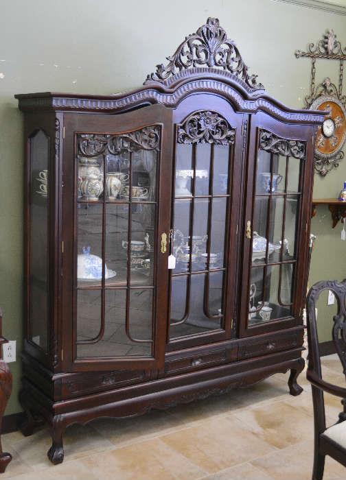 large highly carved china cabinet