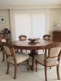 Large round mahogany dining table with custom oversize addition that can be placed on to seat 16!