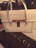A once in a lifetime opportunity to purchase this Gucci  winter white embossed handbag with dust cover