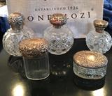 Part of a selection of cut glass sterling top bottles.