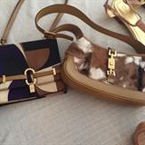 Small textured Gucci handbags.  