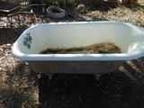 Cast iron tub with all feet and original faucets