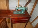 Electric sewing machine in cedar cabinet